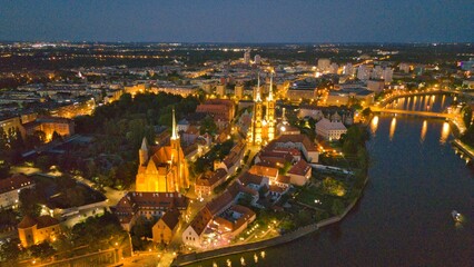 Evening Panorama of Wrocław – Aerial View of Ostrów Tumski with Illuminated Street Lamps