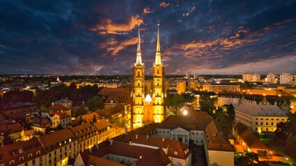 Evening Panorama of Wrocław – Aerial View of Ostrów Tumski with Illuminated Street Lamps