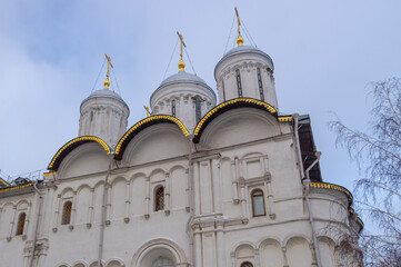 The cathedral with golden domes on the territory of the Moscow Kremlin. Temples of the Moscow Kremlin. The architectural ensemble of Cathedral Square. Culture and heritage in architecture.