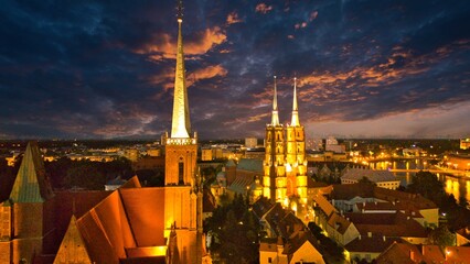 Evening Panorama of Wrocław – Aerial View of Ostrów Tumski with Illuminated Street Lamps