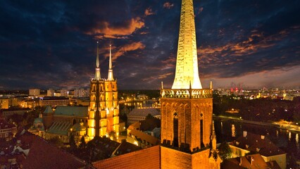 Evening Panorama of Wrocław – Aerial View of Ostrów Tumski with Illuminated Street Lamps