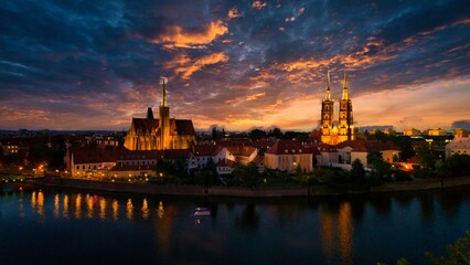 Evening Panorama of Wrocław – Aerial View of Ostrów Tumski with Illuminated Street Lamps