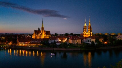 Evening Panorama of Wrocław – Aerial View of Ostrów Tumski with Illuminated Street Lamps