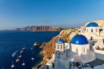 Fototapeta premium Santorini Greece. Oia. Blue domed church at sunrise