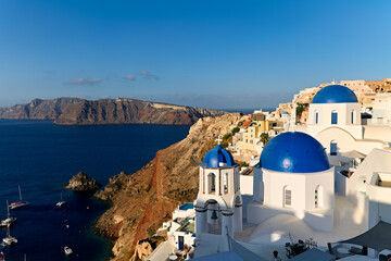 Fototapeta premium Santorini Greece. Oia. Blue domed church at sunrise