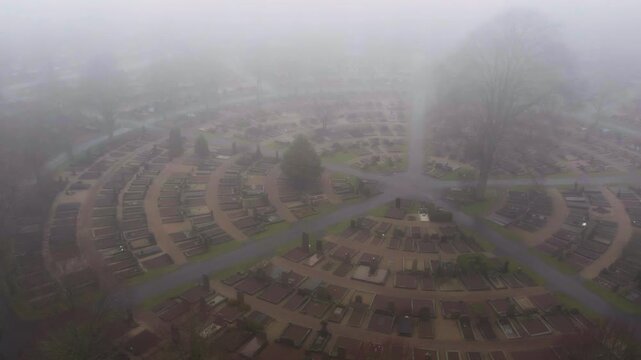 Foggy Atmosphere Over Ostra kyrkogarden Cemetery In Gothenburg, Sweden. Aerial Shot