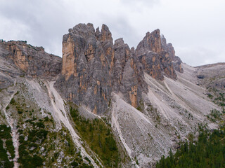 Beautiful landscapes of Dolomites mountains and the forests around the high ridges. Dolomites forest. Croda da Lago peak. Aerial view from the drone.