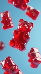 Elegant photo of red gummy bears falling on a blue background, sweet and chewy candy treat.