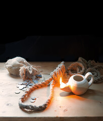 Coins on the table with rope for the gallows