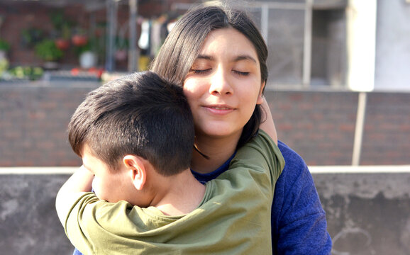 Happy loving little latin siblings.