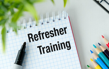 Refresher Training text Sticker with colored pencils and notebook
