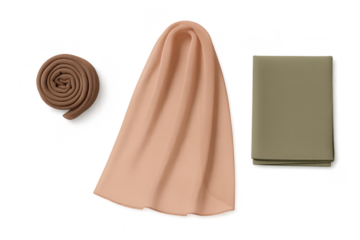 Three various folded and draped fabrics in different colors, isolated on transparent background.