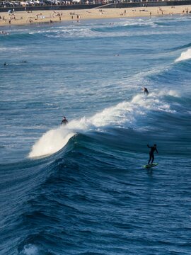 Surf waves at Bondi Beach with carpark in foreground