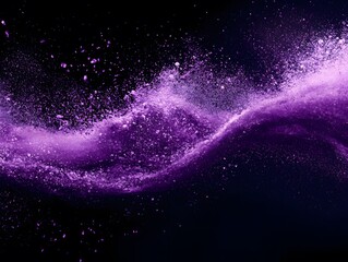 Dramatic burst of purple powder explosion on dark background for abstract concept