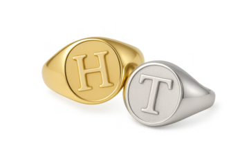 Elegant gold and silver initial signet rings isolated on a transparent background