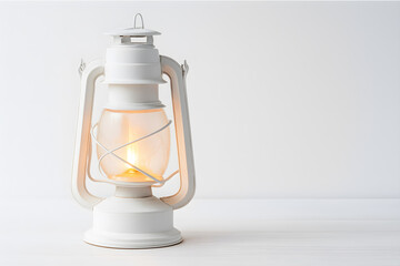 Minimalist vintage lantern with gentle flame on white wooden surface