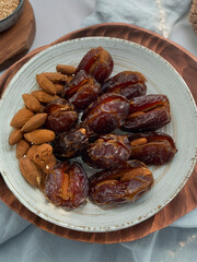 Fresh Dates and Almonds on Ceramic Plate - Healthy Vegan Plant-Based Sweet Dessert Treat