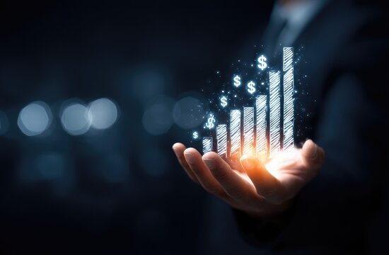 Businessman's hand holding a glowing, digital bar graph, symbolizing financial growth