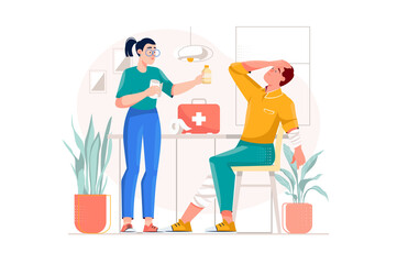 Woman Provides First Aid to Injured Man with Bandages in Bright Indoor Setting with Medical Kit