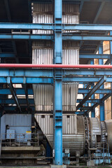 Industrial force draught fan of power plant and blue metal structure at a large factory with engineering detail.