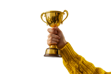 Hand wearing a yellow sweater holding up a golden trophy in celebration isolated on transparent background