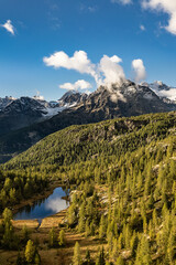 Sunset on Mufulé lake and Bernina peaks, Valmalenco, Italy landscape