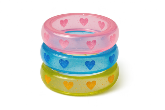 Stack of colorful translucent heart pattern bangles isolated on transparent background