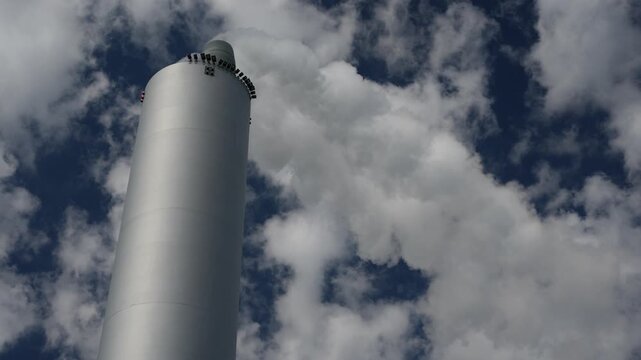 Copenhagen Amager Bakke Copenhill, is a combined heat and power waste-to-energy plant, detail of chimney of power plant while smoking steam