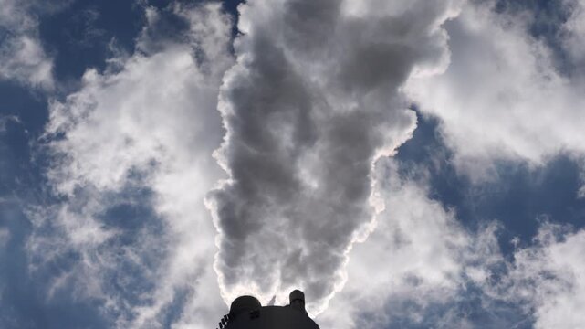 Copenhagen Amager Bakke Copenhill, is a combined heat and power waste-to-energy plant, detail of chimney of power plant while smoking steam