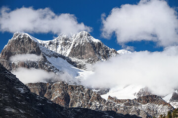 Piz Argient and Piz Zupò wrapped by snow, Bernina massif, Alps landscape