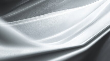 Abstract flowing fabric with silver tones, silky glossy texture, light reflecting shades of grey and black,