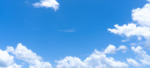 Low angle view and full frame of beautiful blue sky with strange shape of fluffy white clouds in the afternoon on sunny day used as natural background texture in decorative art work