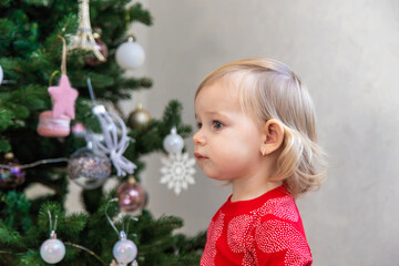 Little Girl Decorating the Christmas Tree