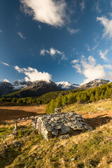 Sunset above Acquanegra village, Valmalenco, Italy landscape