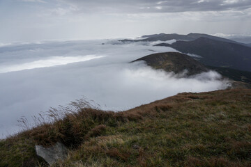 Cloud in a top mountain. Fog on the peak