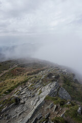 Cloud in a top mountain. Fog on the peak