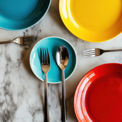 Empty white plate with fork knife and spoon on table set for meal