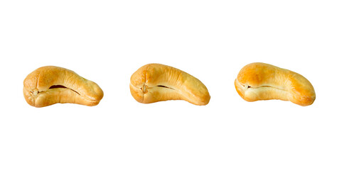 A set of three roasted or baked cashew nuts isolated on white background with clipping path