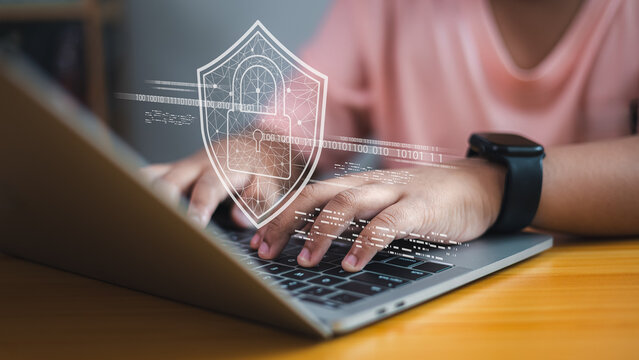 Cybersecurity concept, child using laptop with digital lock shield icon, online data protection and internet safety