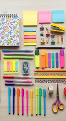 Overhead shot of a wellorganized desk with colorful stationery items such as pens, markers, sticky notes, paper clips, and scissors, creating a vibrant and creative workspace atmosphere on a wooden su