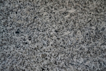 A close up of a stone surface with many small holes