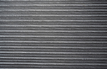 A black and white striped surface with a grainy texture