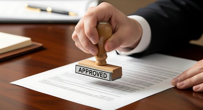 Close up of Hand Stamping approved on a Business Document
