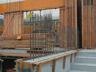 Rebar reinforcement protruding from the concrete work.