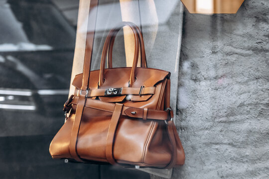Paris, France - September 7, 2025: Herm&egrave;s boutique window display with luxury leather handbags at 24 Rue du Faubourg Saint-Honor&eacute;