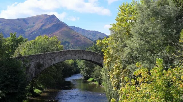 France, Pyrenees-Atlantiques, Basque Country, Saint-Etienne de Baigorry, Roman bridge spanning the Nive River. High quality 4k footage