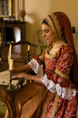 Renaissance woman with French hood with letter