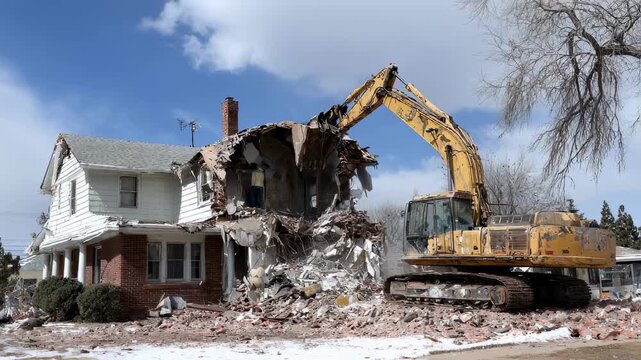 Medium shot capturing a team methodically removing materials from a residential house emphasizing ecofriendly deconstruction practices.