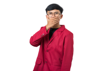 Young college student shushing gesture with finger on lips isolated on white background