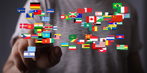Conceptual image of a hand interacting with flags from different countries, representing global...
